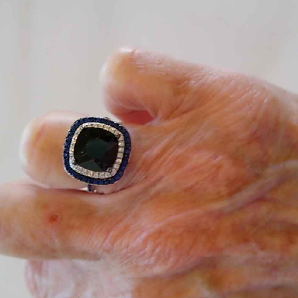 Dark blue ring. ..1/2 inch square size 6